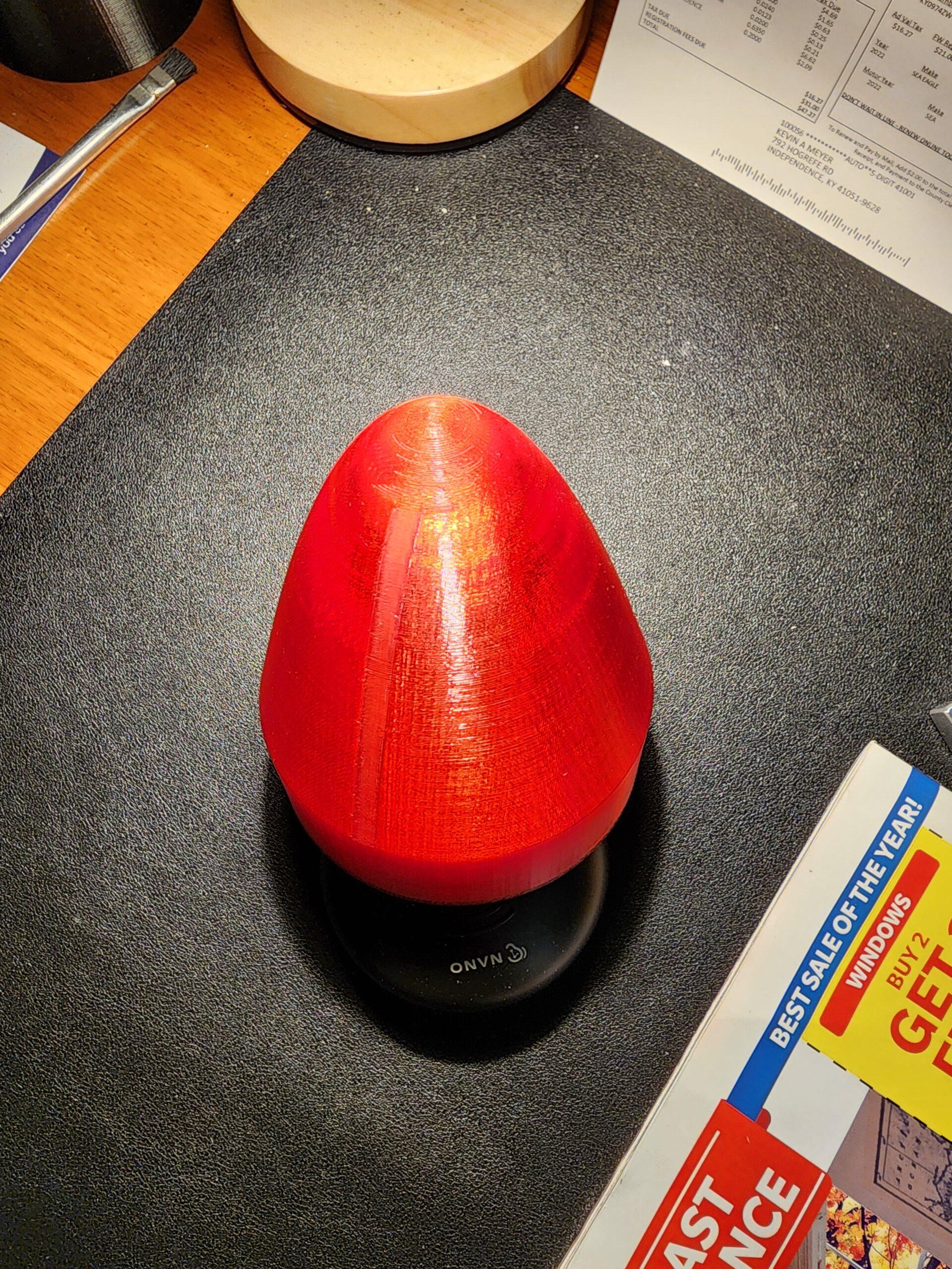 Red bullet-shaped custom 3D-printed cover made by Kevin