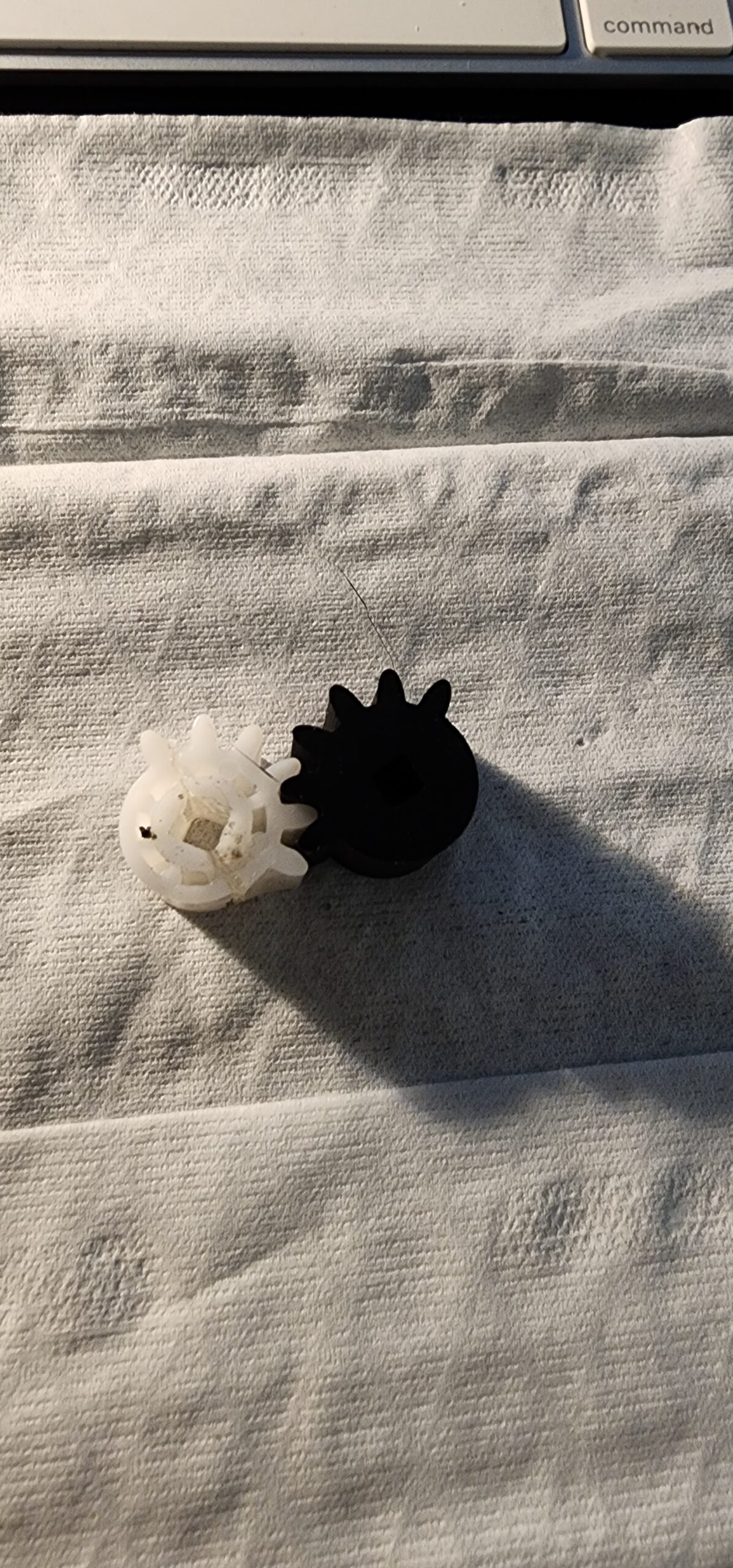 White original Halloween gear beside Kevin’s black printed version on a paper towel